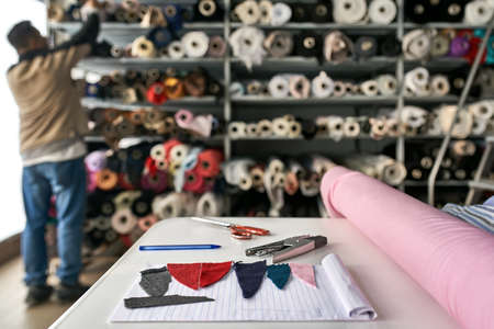 Fabric warehouse with many multicolored textile rollsの写真素材