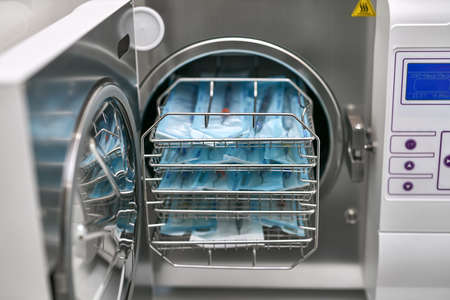 Sterilize machine with opened door and dental probes insideの写真素材