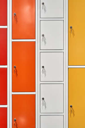 Closeup view at multicolored lockers with keys