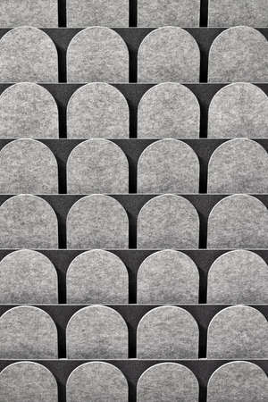 Textured gray surface made of the rounded pieces in the studio. Closeup. Vertical.の写真素材