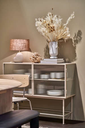 Illuminated room with light walls and furnitureの写真素材