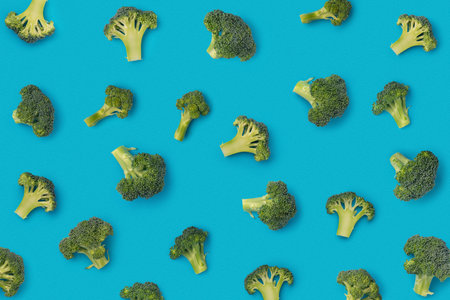 Pattern with broccoli on a blue backgroundの写真素材