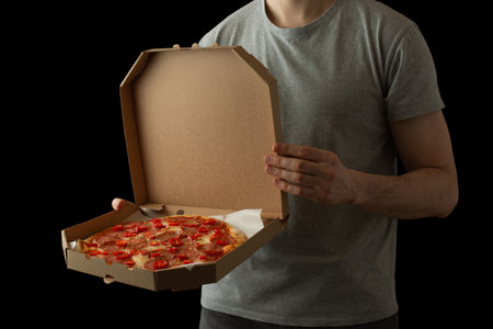 A man with pizza boxes in his hands. Pizza deliveryの写真素材