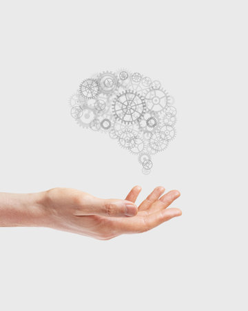 brain idea from gears in hand. the concept of learning, technology, intelligence