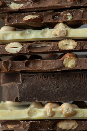 white and milk chocolate with nutsの写真素材