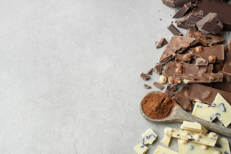 milk chocolate with nuts on a white backgroundの写真素材