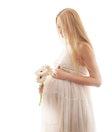 pregnant woman with flower isolated on a white background. studio shotの写真素材