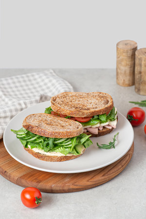 Sandwiches with different fillings in a plate on the tableの写真素材