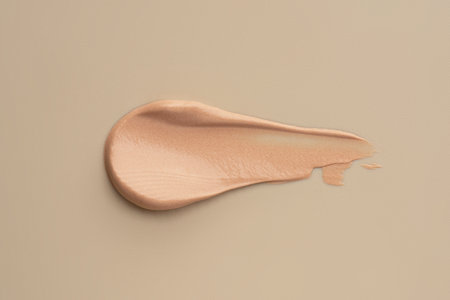 The texture of the foundation on a beige backgroundの写真素材