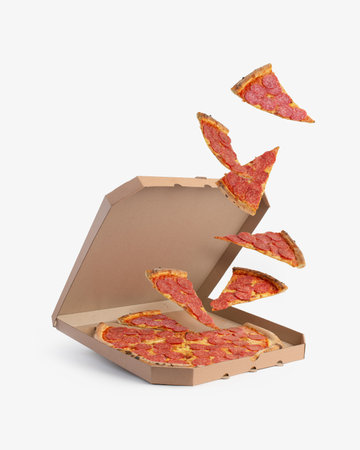 Pieces of pepperoni pizza flying out of a pizza box, levitation.の写真素材