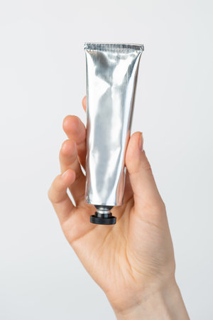 Young woman applying beauty products to her bodyの写真素材