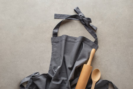 gray linen apron on a gray concrete backgroundの写真素材