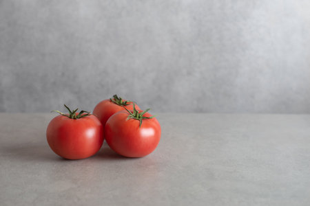 gray concrete background with vegetables and lettuce. Culinary background, horizontal.の写真素材