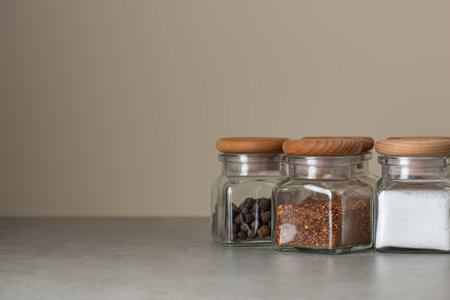 Culinary background with spices on a gray kitchen table, side view.の写真素材