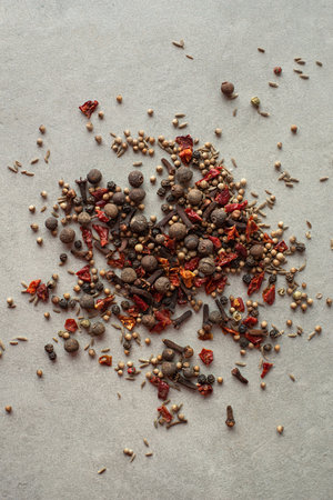 Spices scattered on a gray background, top viewの写真素材