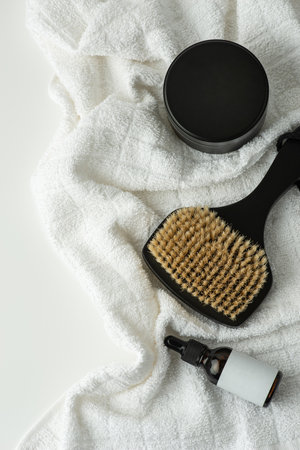 Skin care and massage products on a white towel. view from above.の写真素材