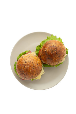 Sandwich with meat, cheese and vegetables isolated on a white backgroundの写真素材