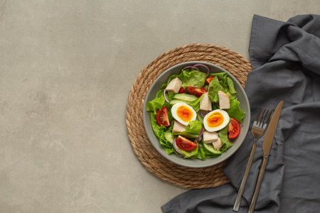 vegetable salad with an egg on a gray backgroundの写真素材
