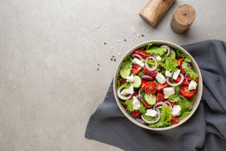 salad with fresh vegetables and cheese on the table, culinary backgroundの写真素材