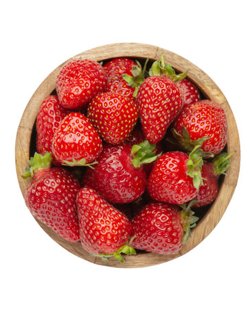 strawberries in wooden plate isolated on gray backgroundの写真素材