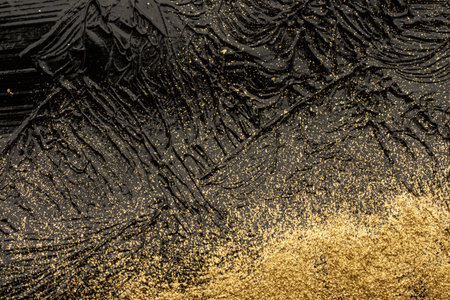 Macro texture of black acrylic paint with golden shineの写真素材