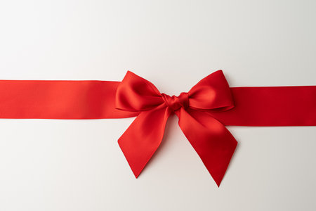 Red bow with ribbon on a white background