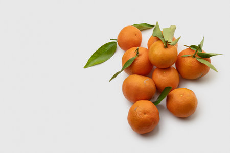 Tangerines on a gray plain background