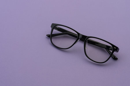 Black Eyeglasses on Purple Background, Minimal Optical Fashion Concept