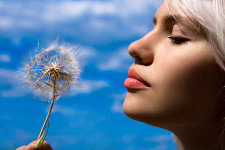 The girl with a dandelionの写真素材