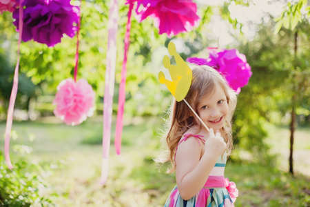 little girl with a toy crownの写真素材