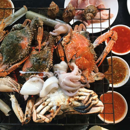 Grilled crab with spicy seafood sauce.の素材