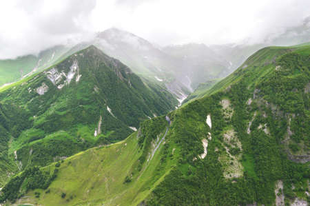 Georgian green cloudy mountainsの写真素材