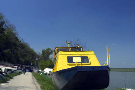 yellow boat on the river sideの写真素材