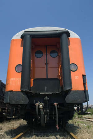 orange waggon on railway