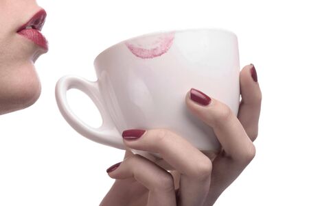 red lips with white cup of coffeeの写真素材