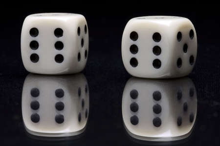 ivory gamble cubes on glassの写真素材