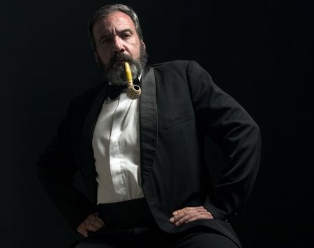 thoughtful gentleman is smoking pipeの写真素材