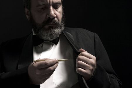 portrait of gentleman with pencil in handの写真素材