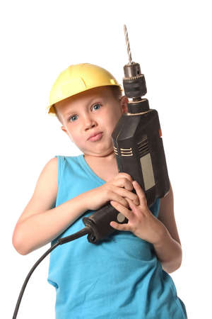a boy is holding big black drillの写真素材