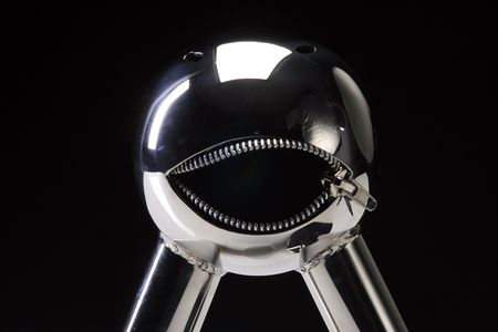 little metal shiny robot with zipper mouthの写真素材