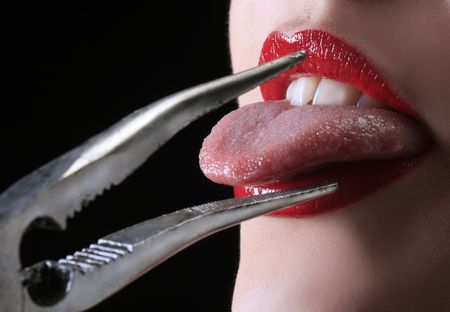 metal pincers with red lips are pulling tounge 