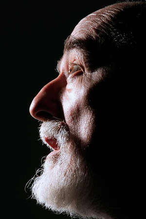 portrait of a shocked senior man who is looking