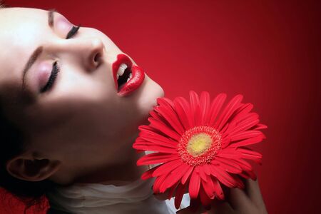 a beauty girl with red lips in sensual expression の写真素材