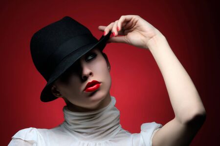 a pretty fashionable girl with retro hatの写真素材