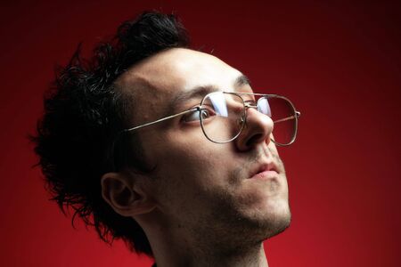 a crazy doctor with glasses on redの写真素材