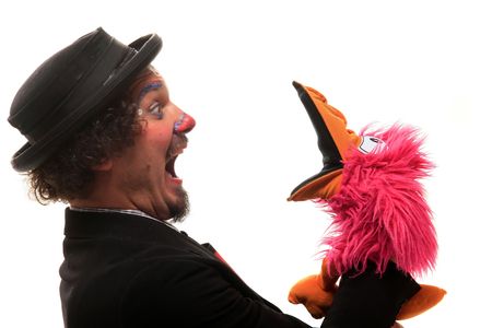 a funny clown is showing something with hand