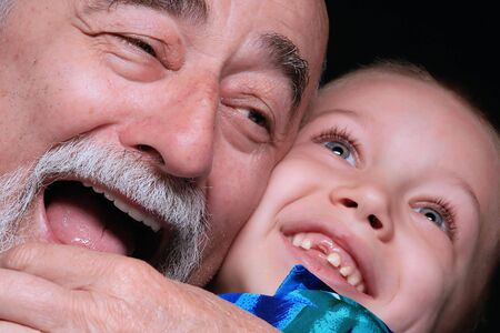 a portrait of a blond boy with grandpa