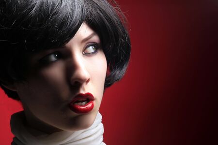 portrait of a beauty retro lady on redの写真素材