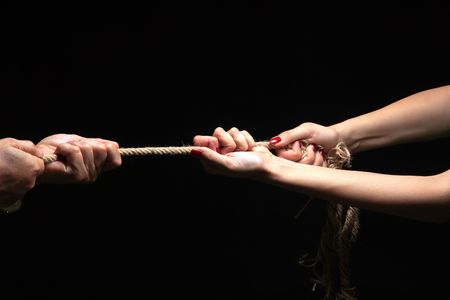 photo of a rope with hand pullingの写真素材