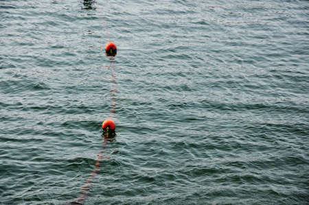  Orange buoy in the seaの写真素材